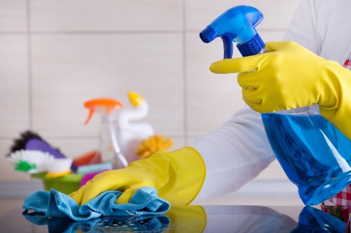 Professional carpet cleaner in Roehampton deep cleaning a living room carpet