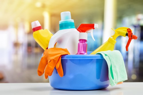 Cleaning team preparing deep cleaning equipment safely