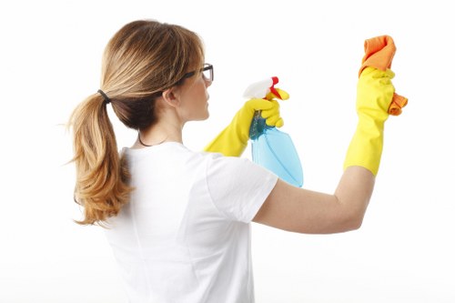 Operative using protective gear during a deep clean