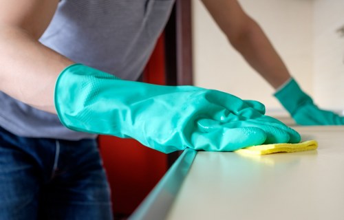 Professional deep cleaning work in progress in a kitchen area